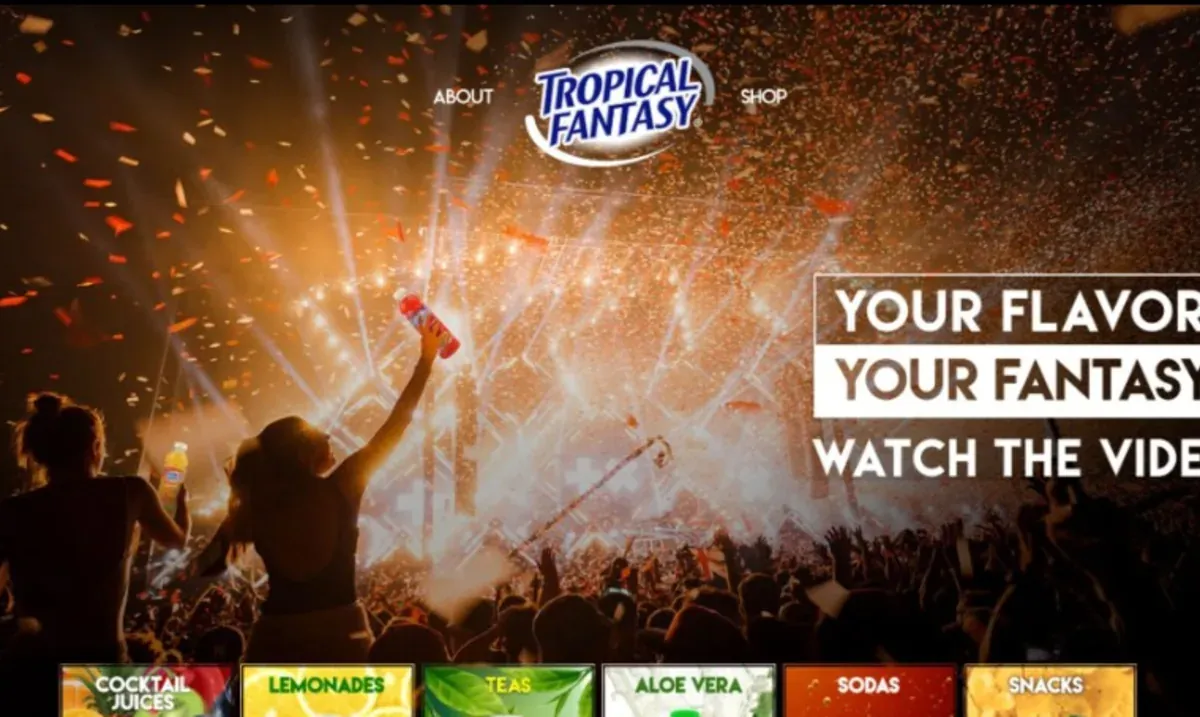 Captura da homepage da Tropical Fantasy — site de marca de bebidas com hero de festival e categorias de produto